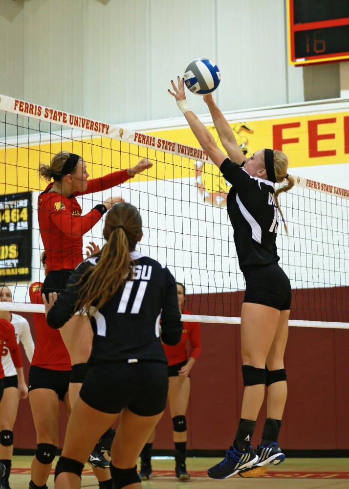 GVL / Kevin Sielaff
Kaleigh Lound (15) attempts a block. The Lakers fall to the Bulldogs at Ferris State University Sept. 29 by a margin of 3-1. 