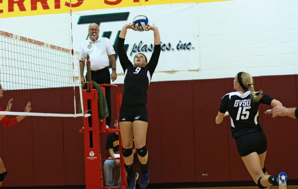 GVL / Kevin Sielaff
Katie Olson (9) sets the ball. The Lakers fall to the Bulldogs at Ferris State University Sept. 29 by a margin of 3-1.