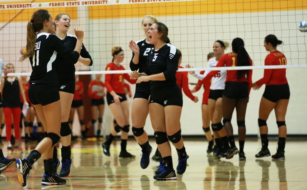 GVL / Kevin Sielaff
Taylor Stewart (5) celebreates with her teammates. The Lakers fall to the Bulldogs at Ferris State University Sept. 29 by a margin of 3-1. 