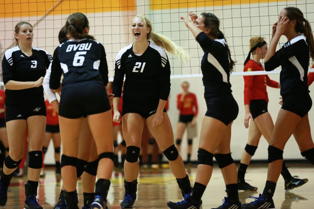 GVL / Kevin Sielaff
Staci Brower (21) celebrates with her team after a point scored. The Lakers fall to the Bulldogs at Ferris State University Sept. 29 by a margin of 3-1. 