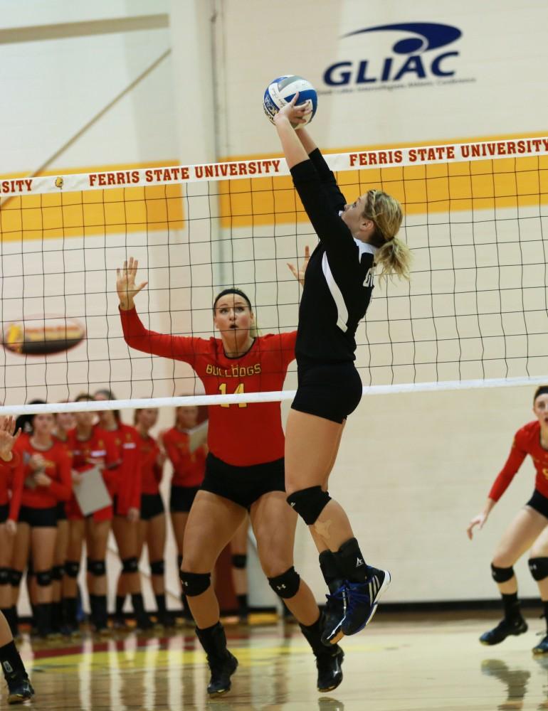 GVL / Kevin Sielaff
Katie Olson (9) sets the ball. The Lakers fall to the Bulldogs at Ferris State University Sept. 29 by a margin of 3-1. 