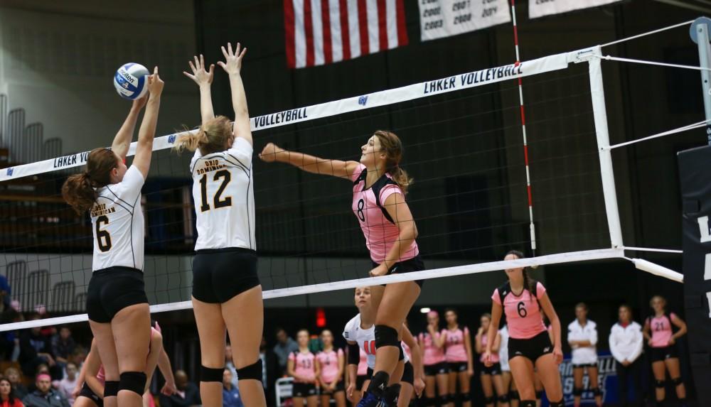 GVL / Kevin Sielaff - Brooke Smith (8) hits the ball through traffic. Grand Valley squares off against Ohio Dominican and claims the victory with a final score of 3-1.