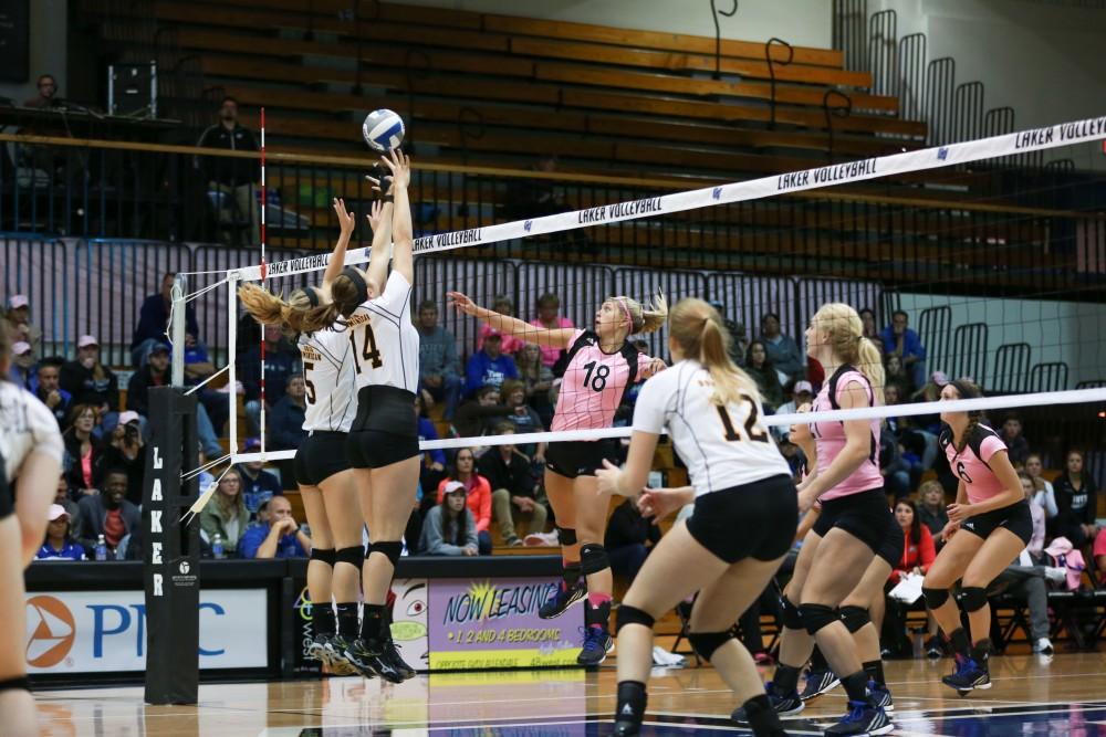 GVL / Kevin Sielaff - Shannon Winicki (18) tips the ball of two Ohio defenders. Grand Valley squares off against Ohio Dominican and claims the victory with a final score of 3-1.