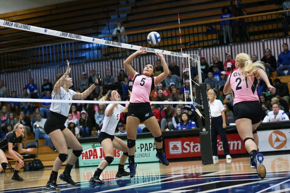 GVL / Kevin Sielaff - Taylor Stewart (5) sets the ball for Staci Brower (21). Grand Valley squares off against Ohio Dominican and claims the victory with a final score of 3-1.