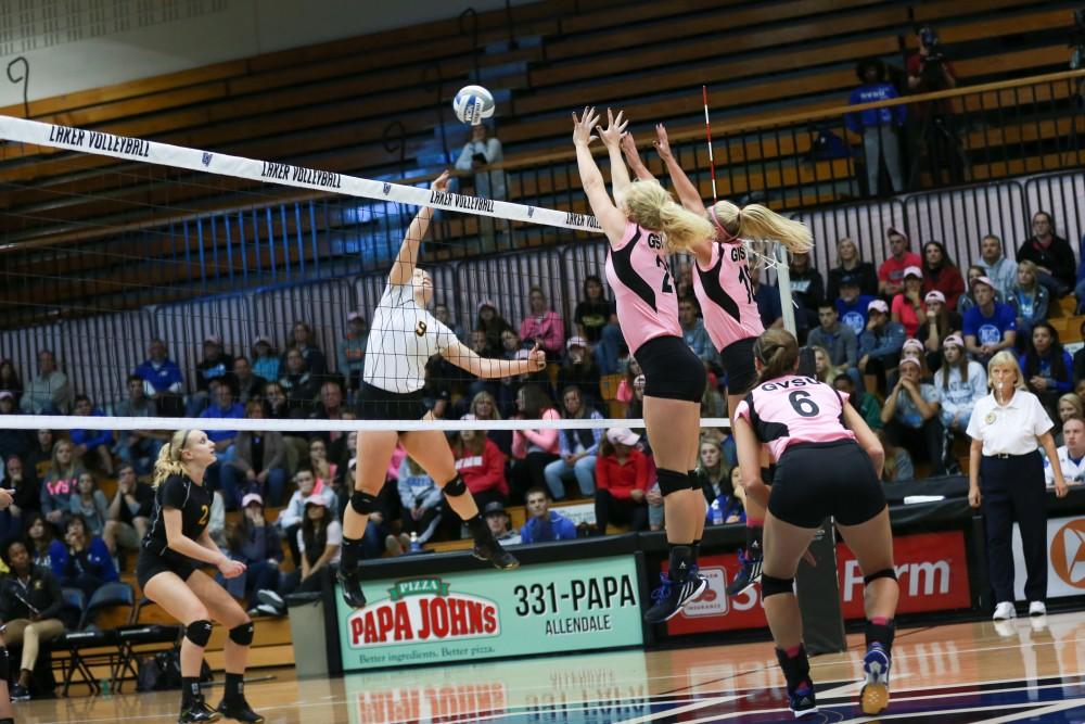 GVL / Kevin Sielaff - Staci Brower (21) and Shannon Winicki (18) rise up for a block. Grand Valley squares off against Ohio Dominican and claims the victory with a final score of 3-1.