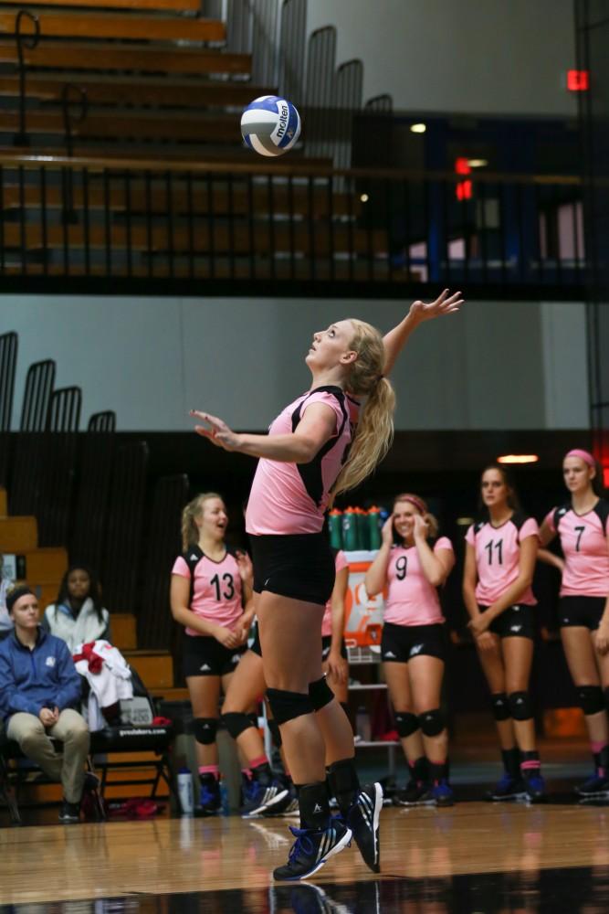 GVL / Kevin Sielaff - Staci Brower (21) serves the ball. Grand Valley squares off against Ohio Dominican and claims the victory with a final score of 3-1.