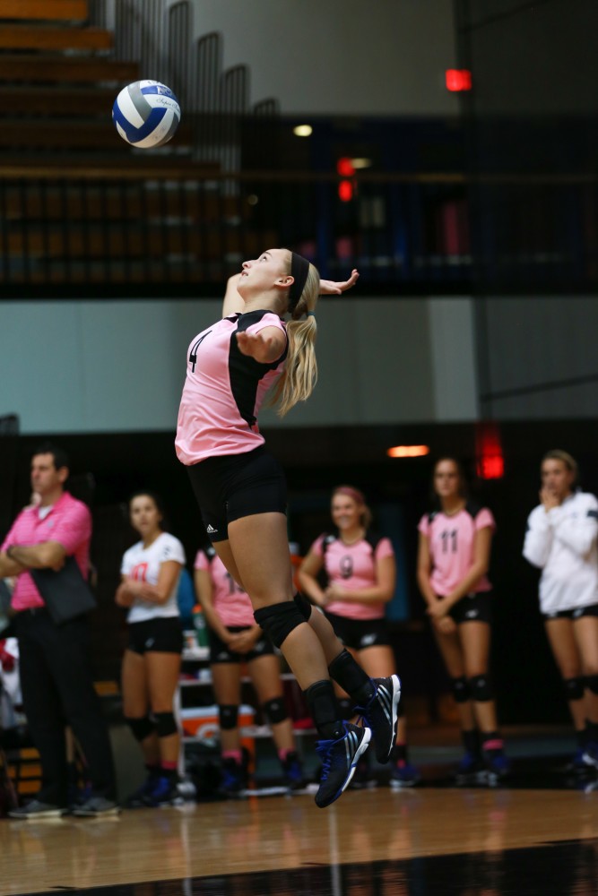 GVL / Kevin Sielaff - Kaylene Norris (4) serves the ball. Grand Valley squares off against Ohio Dominican and claims the victory with a final score of 3-1.