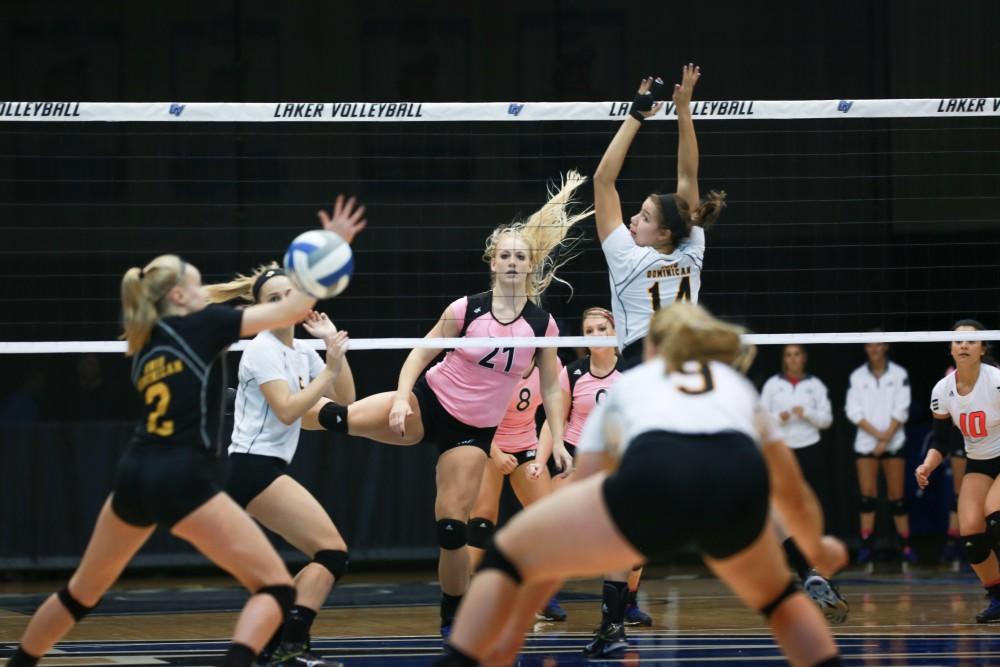 GVL / Kevin Sielaff - Staci Brower (21) splits the ODU defense for a point. Grand Valley squares off against Ohio Dominican and claims the victory with a final score of 3-1.