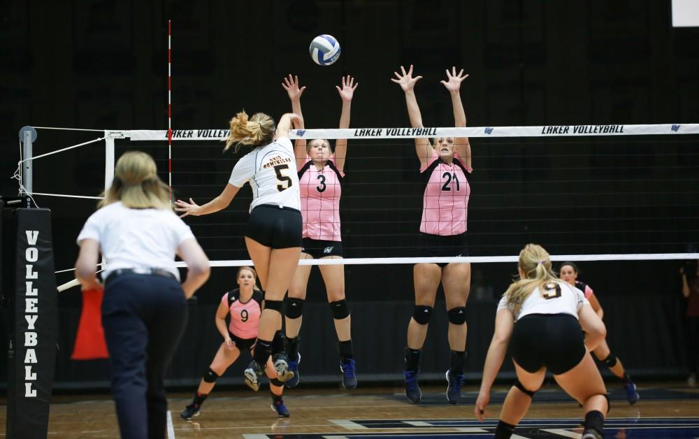 GVL / Kevin Sielaff - Jessica Majerle (3) and Staci Brower (21) leap up for a block. Grand Valley squares off against Ohio Dominican and claims the victory with a final score of 3-1.