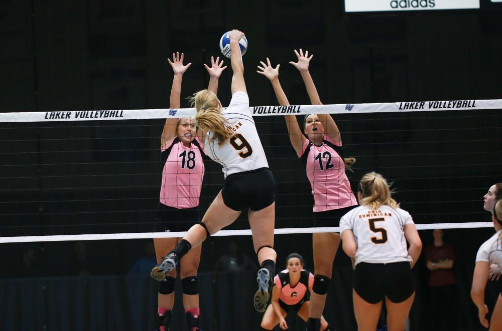 GVL / Kevin Sielaff - Shannon Winicki (18) and Jillian Butsavich (12) jump up for a block. Grand Valley squares off against Ohio Dominican and claims the victory with a final score of 3-1.