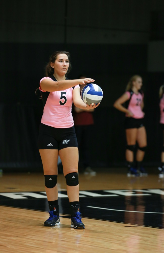 GVL / Kevin Sielaff - Taylor Stewart (5) prepares to serve. Grand Valley squares off against Ohio Dominican and claims the victory with a final score of 3-1.