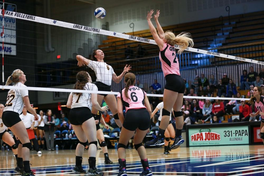 GVL / Kevin Sielaff - Staci Brower (21) looks to block on incoming spike. Grand Valley squares off against Ohio Dominican and claims the victory with a final score of 3-1.