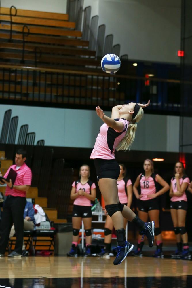 GVL / Kevin Sielaff - Kaylene Norris (4) serves the ball. Grand Valley squares off against Ohio Dominican and claims the victory with a final score of 3-1.