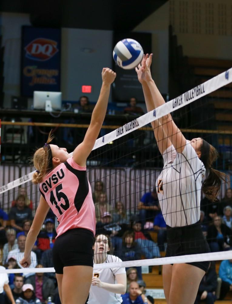 GVL / Kevin Sielaff - Kaleigh Lound (15) rises up to block a tip. Grand Valley squares off against Ohio Dominican and claims the victory with a final score of 3-1.