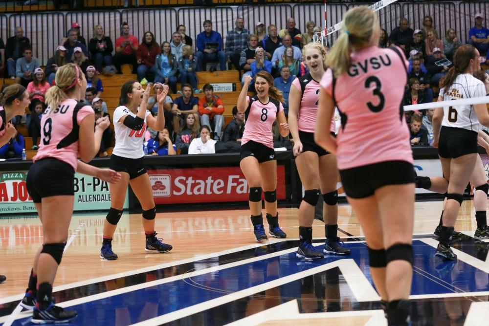 GVL / Kevin Sielaff - Brooke Smith (8) celebrates with her team after a point scored. Grand Valley squares off against Ohio Dominican and claims the victory with a final score of 3-1.