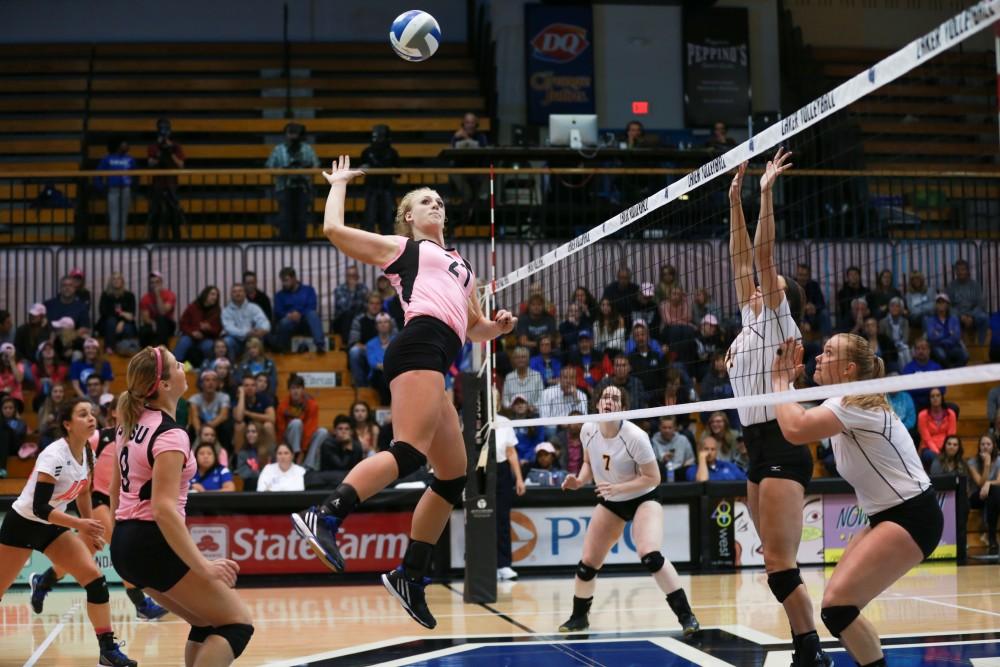 GVL / Kevin Sielaff - Staci Brower (21) winds up for a kill. Grand Valley squares off against Ohio Dominican and claims the victory with a final score of 3-1.