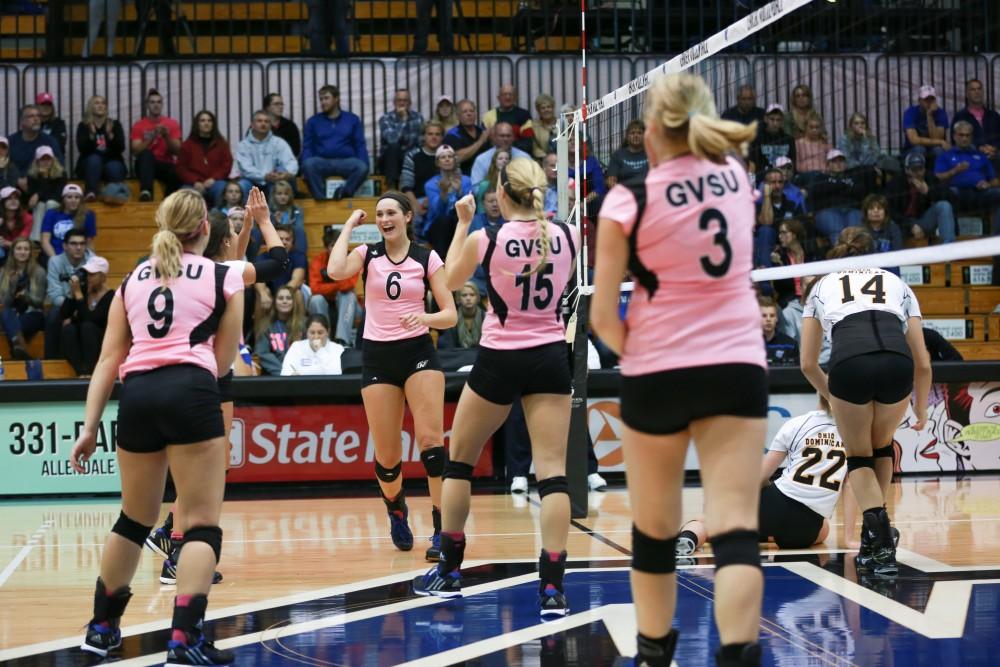 GVL / Kevin Sielaff - Betsy Rhonda (6) and company celebrate after a point scored. Grand Valley squares off against Ohio Dominican and claims the victory with a final score of 3-1.