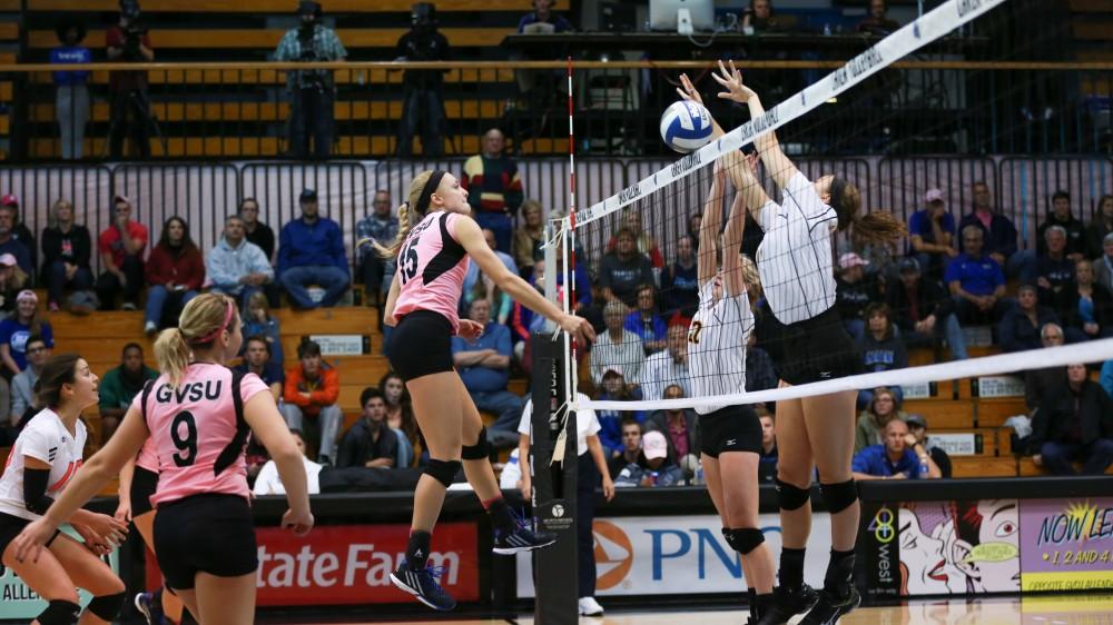 GVL / Kevin Sielaff - Kaleigh Lound (15) has a spike blocked by the ODU defense. Grand Valley squares off against Ohio Dominican and claims the victory with a final score of 3-1.