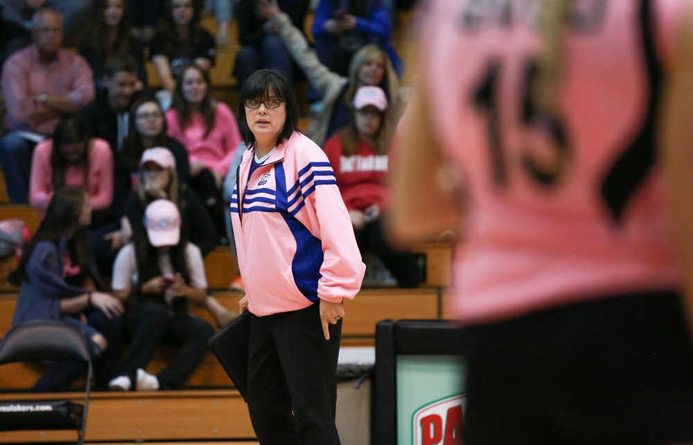 GVL / Kevin Sielaff - Head coach Deanne Scanlon looks on toward the play. Grand Valley squares off against Ohio Dominican and claims the victory with a final score of 3-1.