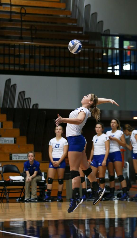 GVL / Kevin Sielaff - Katie Olson (9) serves the ball. Grand Valley sweeps Tiffin Oct. 3 after three sets inside the Fieldhouse Arena in Allendale.