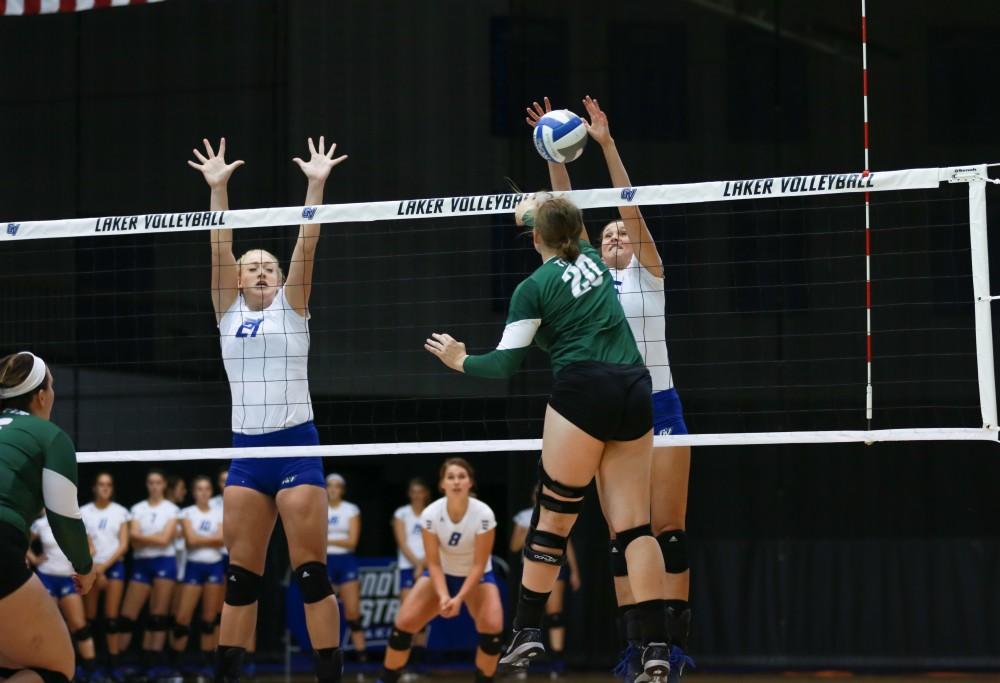 GVL / Kevin Sielaff - Betsy Rhonda (6) gets a hand on an incoming tip. Grand Valley sweeps Tiffin Oct. 3 after three sets inside the Fieldhouse Arena in Allendale.