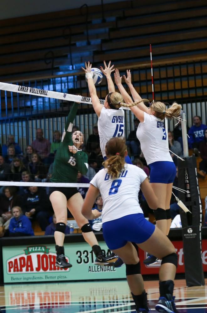 GVL / Kevin Sielaff - Kaleigh Lound (15) and Jessica Majerle (3) jump to block a spike. Grand Valley sweeps Tiffin Oct. 3 after three sets inside the Fieldhouse Arena in Allendale.