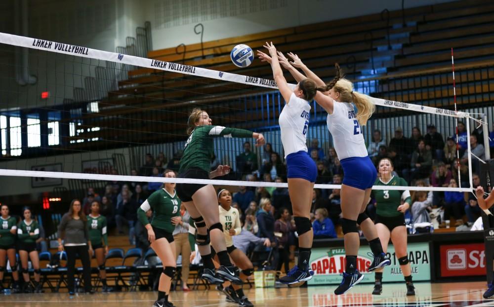 GVL / Kevin Sielaff - Betsy Rhonda (6) and Staci Brower (21) block an incoming spike. Grand Valley sweeps Tiffin Oct. 3 after three sets inside the Fieldhouse Arena in Allendale.