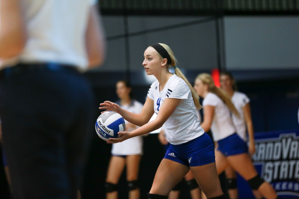 GVL / Kevin Sielaff - Kaylene Norris (4) serves the ball. Grand Valley sweeps Tiffin Oct. 3 after three sets inside the Fieldhouse Arena in Allendale.