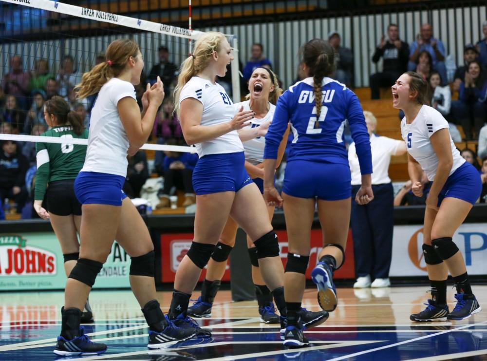 GVL / Kevin Sielaff - The Lakers celebrate after they win a set. Grand Valley sweeps Tiffin Oct. 3 after three sets inside the Fieldhouse Arena in Allendale.