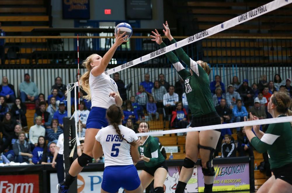 GVL / Kevin Sielaff - Staci Brower (21) tips the ball over to the Tiffin zone. Grand Valley sweeps Tiffin Oct. 3 after three sets inside the Fieldhouse Arena in Allendale.