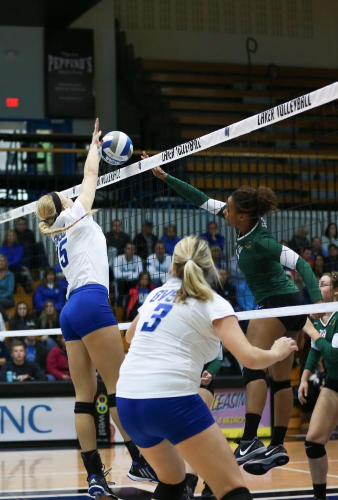 GVL / Kevin Sielaff - Kaleigh Lound (15) blocks a tip. Grand Valley sweeps Tiffin Oct. 3 after three sets inside the Fieldhouse Arena in Allendale.