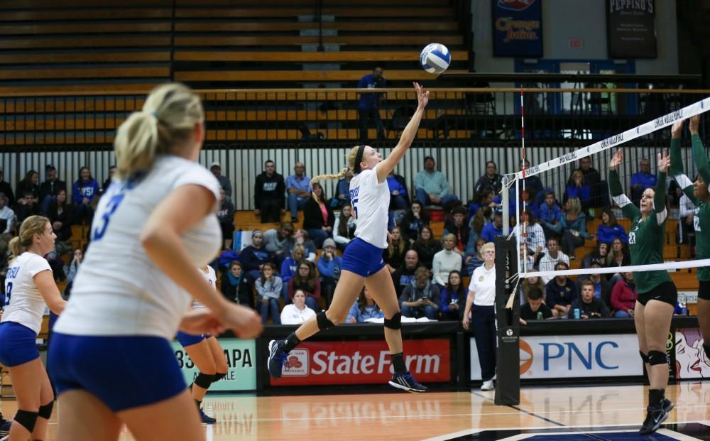 GVL / Kevin Sielaff - Kaleigh Lound (15) tips the ball high over the net. Grand Valley sweeps Tiffin Oct. 3 after three sets inside the Fieldhouse Arena in Allendale.