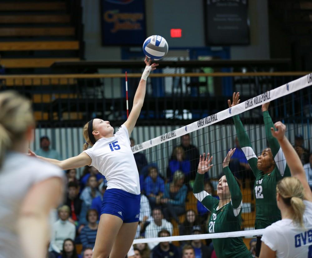 GVL / Kevin Sielaff - Kaleigh Lound (15) reaches to get a finger on the ball. Grand Valley sweeps Tiffin Oct. 3 after three sets inside the Fieldhouse Arena in Allendale.