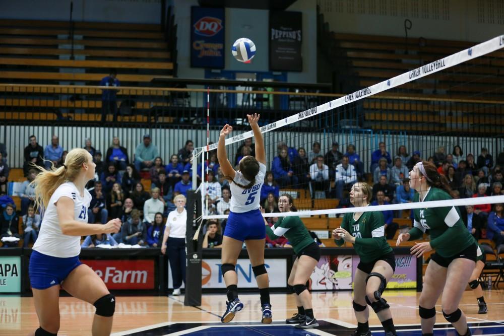 GVL / Kevin Sielaff - Taylor Stewart (5) sets the ball behind her for Staci Brower (21). Grand Valley sweeps Tiffin Oct. 3 after three sets inside the Fieldhouse Arena in Allendale.