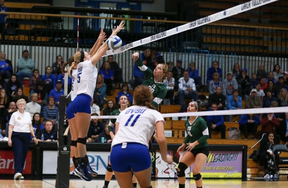 GVL / Kevin Sielaff - Kaleigh Lound (15) rises up for a block. Grand Valley sweeps Tiffin Oct. 3 after three sets inside the Fieldhouse Arena in Allendale.