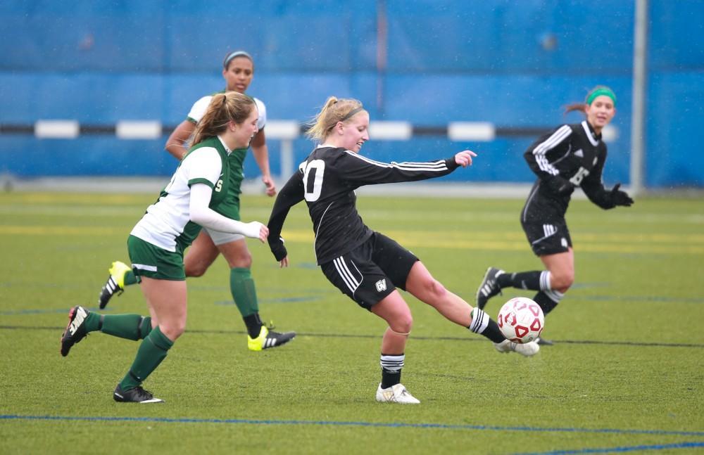 GVL / Kevin Sielaff - Jenny Winters (20) clears the ball out of Grand Valley's zone.  Grand Valley's women's club soccer team squares off against Michigan State on a rainy Oct. 31. The Lakers were defeated, with a final score of 2-0 in favor of Michigan State.