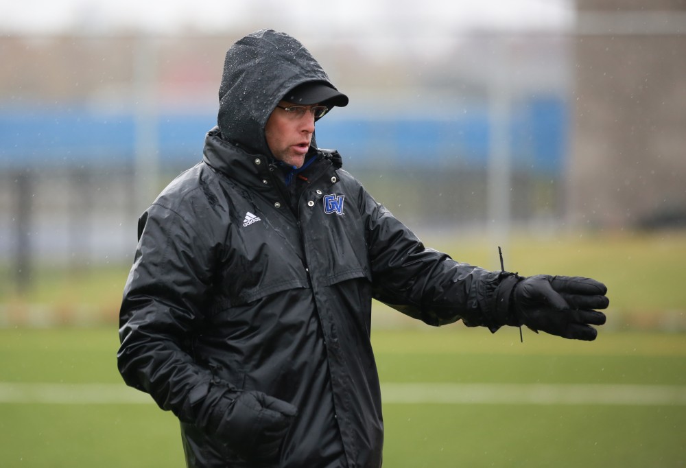 GVL / Kevin Sielaff - Head coach Jeff Crooks addresses his team.  Grand Valley's women's club soccer team squares off against Michigan State on a rainy Oct. 31. The Lakers were defeated, with a final score of 2-0 in favor of Michigan State.