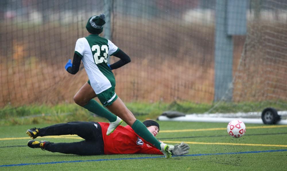 GVL / Kevin Sielaff -  Grand Valley's goal keeper makes a save to keep the score at 2-0.  Grand Valley's women's club soccer team squares off against Michigan State on a rainy Oct. 31. The Lakers were defeated, with a final score of 2-0 in favor of Michigan State.