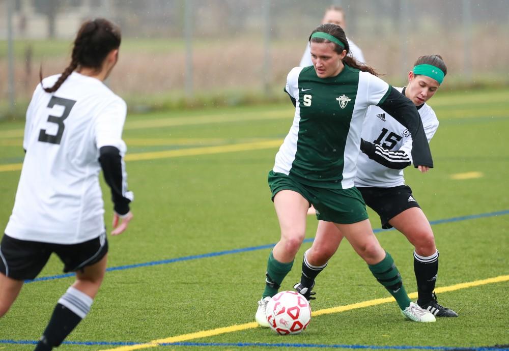 GVL / Kevin Sielaff - Michigan State takes control near the end of the match.  Grand Valley's women's club soccer team squares off against Michigan State on a rainy Oct. 31. The Lakers were defeated, with a final score of 2-0 in favor of Michigan State.