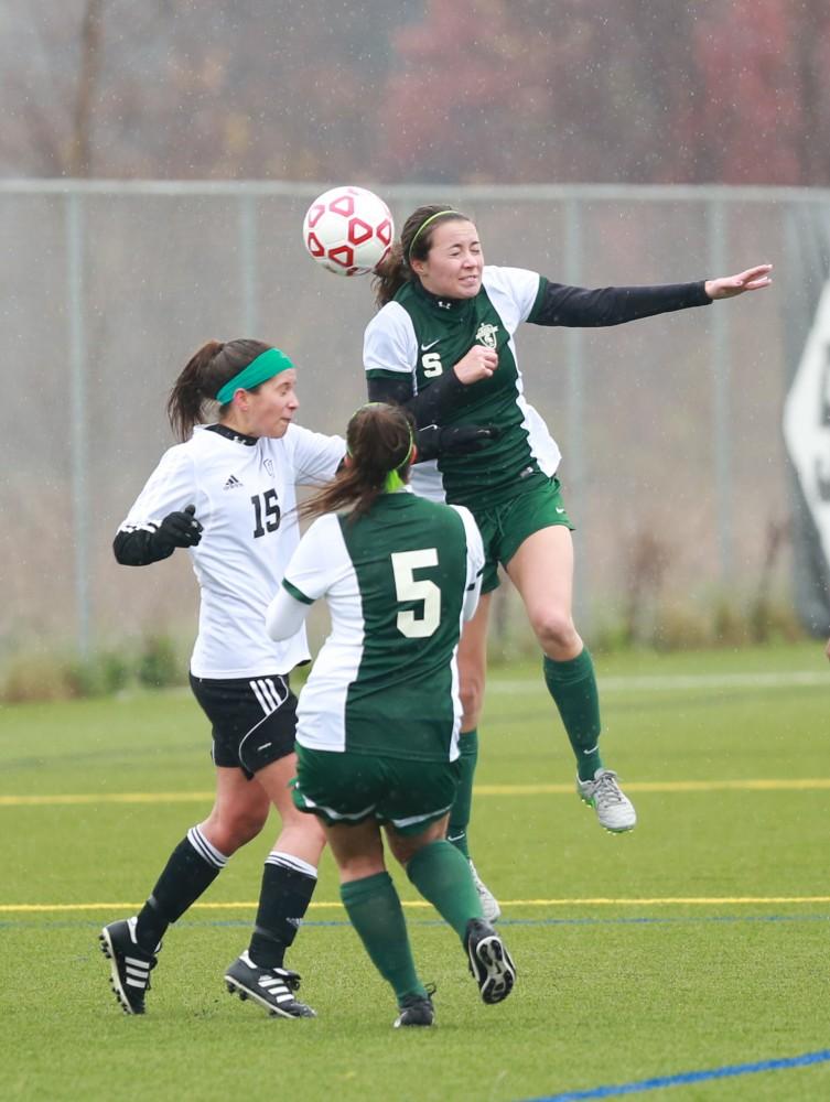 GVL / Kevin Sielaff - Michigan State's offense pressures Grand Valley in their zone.  Grand Valley's women's club soccer team squares off against Michigan State on a rainy Oct. 31. The Lakers were defeated, with a final score of 2-0 in favor of Michigan State.