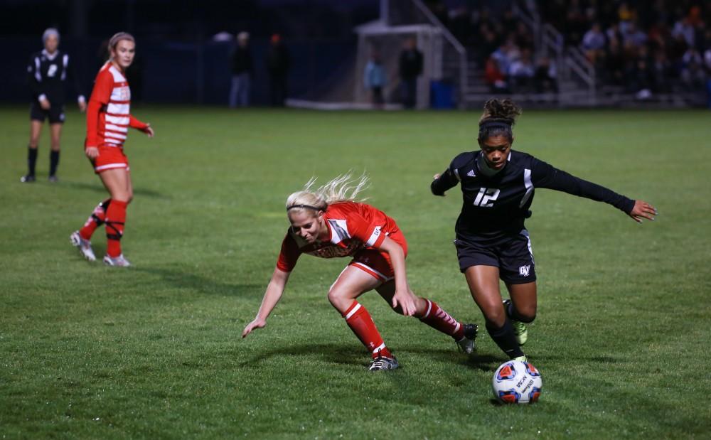 GVL / Kevin Sielaff - Jayma Martin (12) jukes around Ferris' defense.  The Lakers defeat the Bulldogs with a final score of 2-0 Oct. 30 in Allendale. Grand Valley will advance to the GLIAC tournament starting Nov. 3.