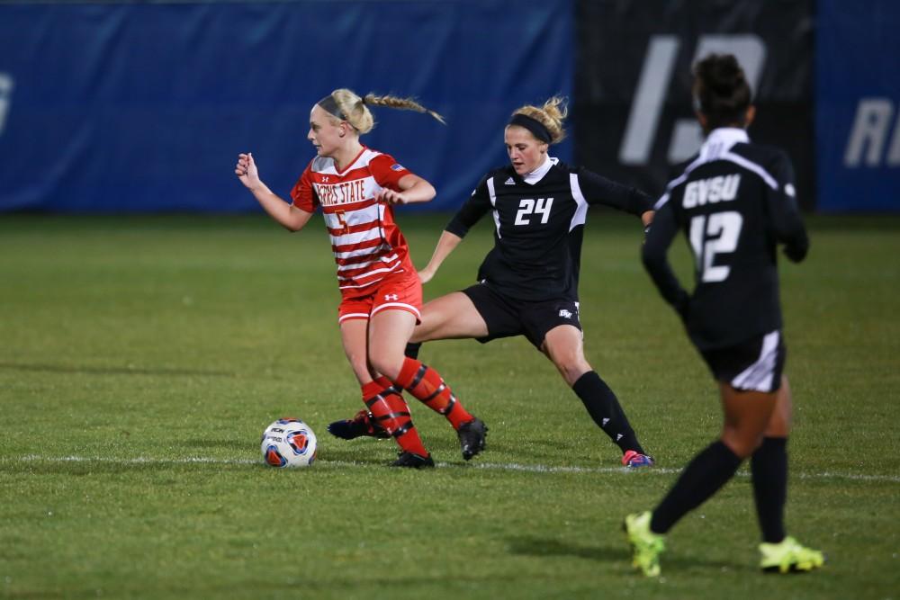 GVL / Kevin Sielaff - Tracey McCoy (24) steps through to challenge Kate Kelly (5).   The Lakers defeat the Bulldogs with a final score of 2-0 Oct. 30 in Allendale. Grand Valley will advance to the GLIAC tournament starting Nov. 3.