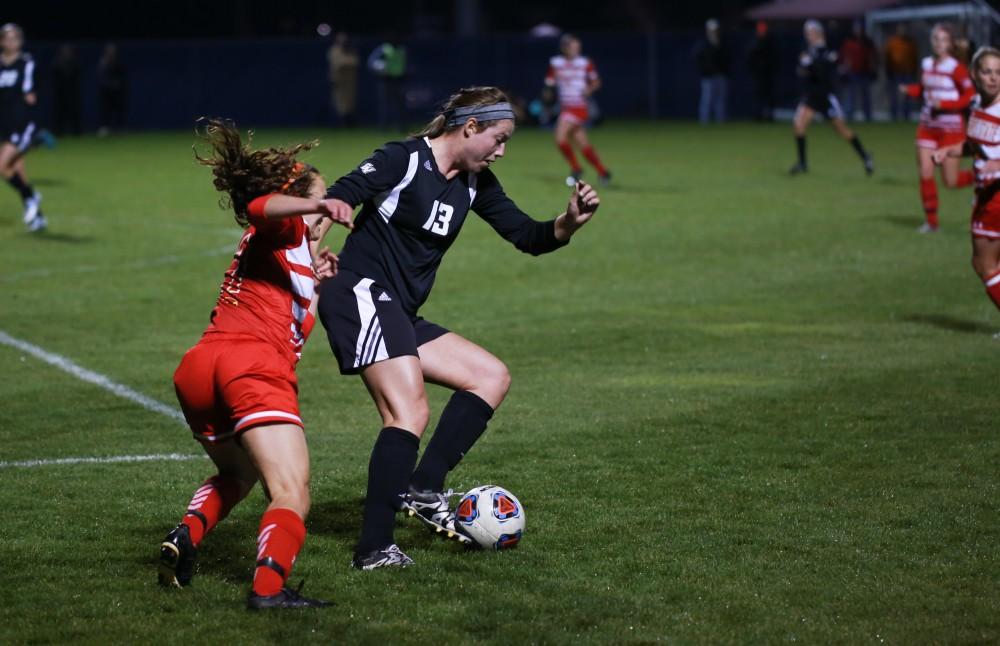 GVL / Kevin Sielaff - Marti Corby (13) jukes around Ferris' defense.  The Lakers defeat the Bulldogs with a final score of 2-0 Oct. 30 in Allendale. Grand Valley will advance to the GLIAC tournament starting Nov. 3.