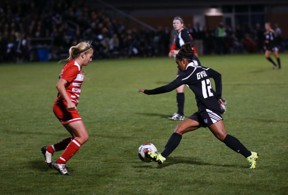 GVL / Kevin Sielaff - Jayma Martin (12) pushes the ball down field.  The Lakers defeat the Bulldogs with a final score of 2-0 Oct. 30 in Allendale. Grand Valley will advance to the GLIAC tournament starting Nov. 3.