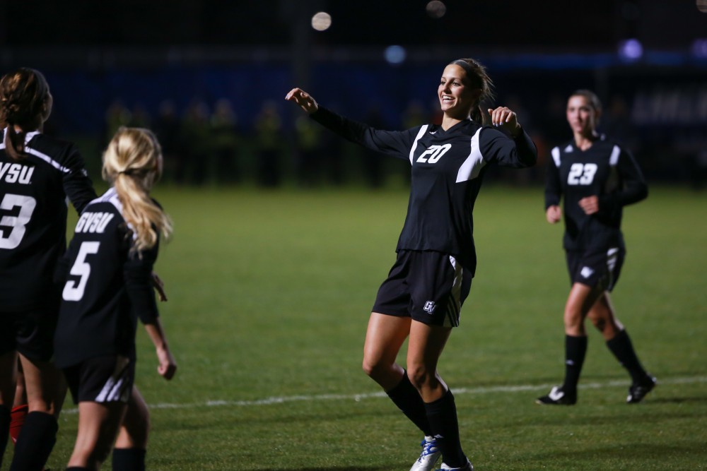 GVL / Kevin Sielaff - Gabriella Mencotti (20) heads the ball into the net and celebrates her goal.  The Lakers defeat the Bulldogs with a final score of 2-0 Oct. 30 in Allendale. Grand Valley will advance to the GLIAC tournament starting Nov. 3.