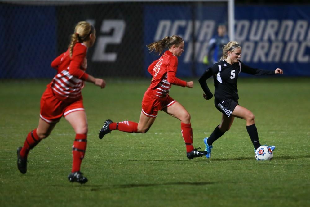 GVL / Kevin Sielaff -  Kendra Stauffer (5) pushes the ball up field.  The Lakers defeat the Bulldogs with a final score of 2-0 Oct. 30 in Allendale. Grand Valley will advance to the GLIAC tournament starting Nov. 3.