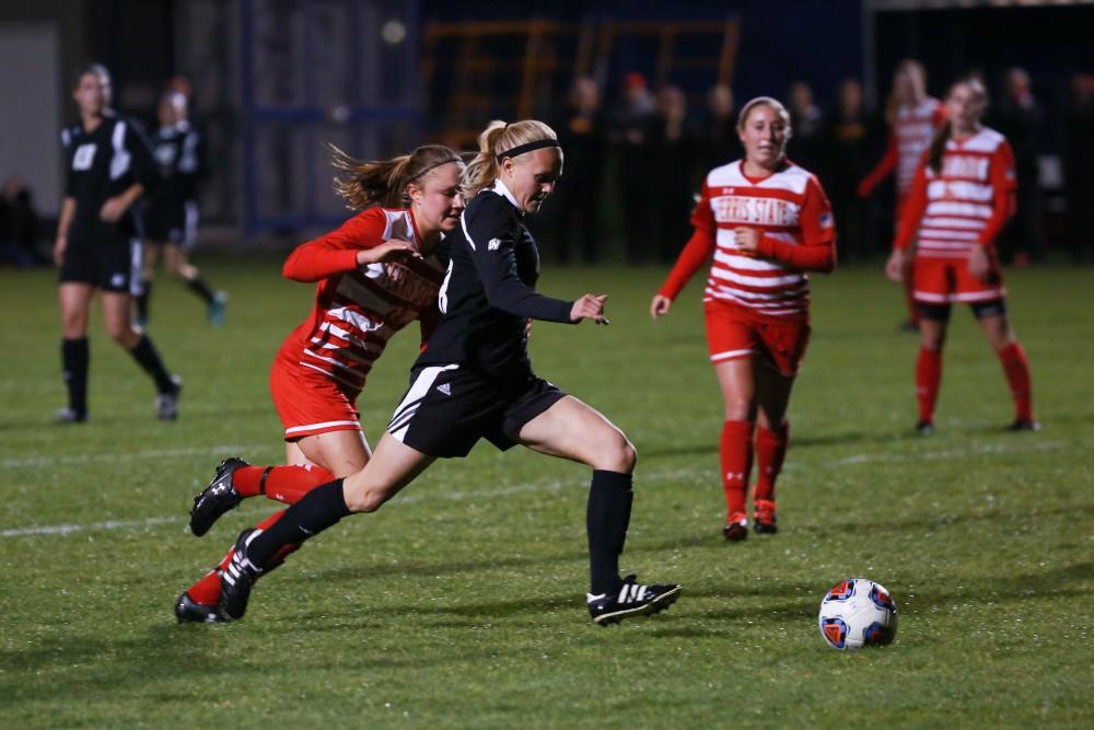 GVL / Kevin Sielaff - Maddison Reynolds (18) tries a shot, and scores.  The Lakers defeat the Bulldogs with a final score of 2-0 Oct. 30 in Allendale. Grand Valley will advance to the GLIAC tournament starting Nov. 3.