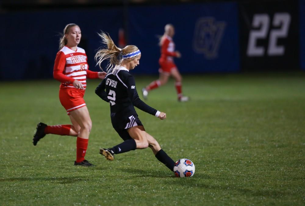 GVL / Kevin Sielaff - Katie Klunder (2) passes the ball.  The Lakers defeat the Bulldogs with a final score of 2-0 Oct. 30 in Allendale. Grand Valley will advance to the GLIAC tournament starting Nov. 3.