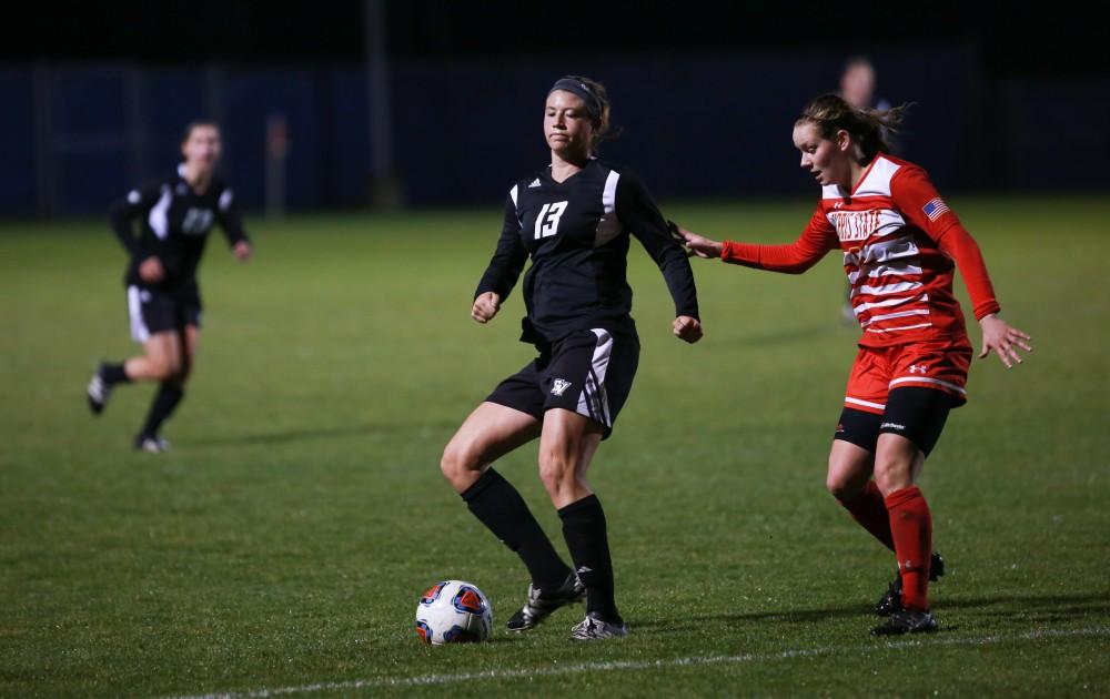 GVL / Kevin Sielaff - Marti Corby (13) sets up a play ouside the box.  The Lakers defeat the Bulldogs with a final score of 2-0 Oct. 30 in Allendale. Grand Valley will advance to the GLIAC tournament starting Nov. 3.