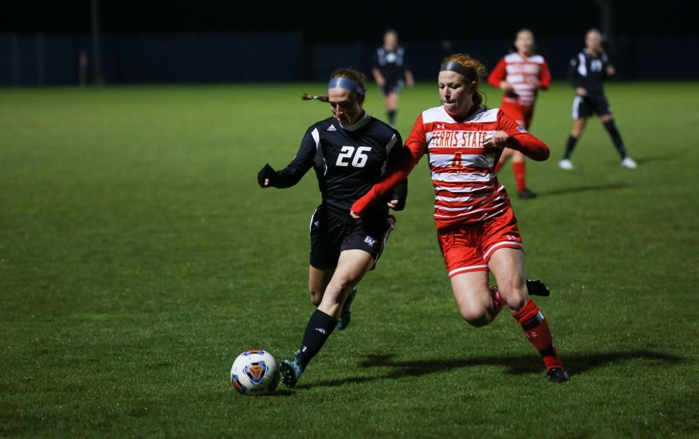 GVL / Kevin Sielaff - Lindsay Ebeling (26) battles for position with Ferris' Olivia Brewer (4).  The Lakers defeat the Bulldogs with a final score of 2-0 Oct. 30 in Allendale. Grand Valley will advance to the GLIAC tournament starting Nov. 3.